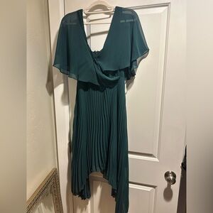 Hunter green formal midi-length dress with sheer shoulder drape + pleated skirt